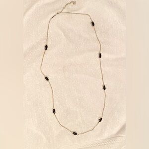 Kendra Scott necklace.